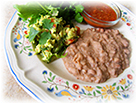 A plate of tempting refried beans and guacamole are mainstays of New Mexico eating.